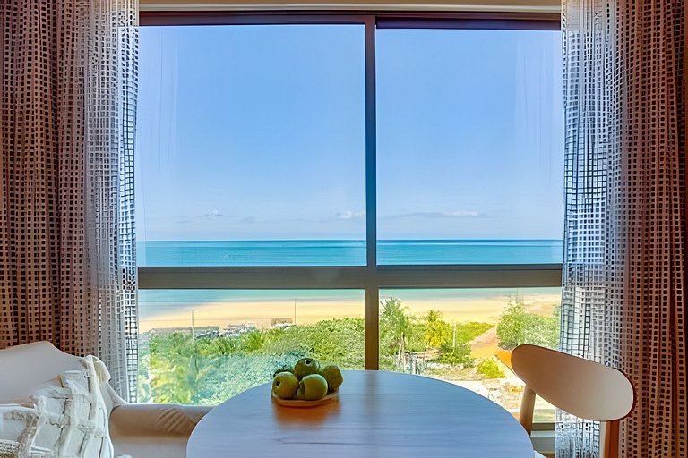 Flat Elegante com Vista Panorâmica para o Mar